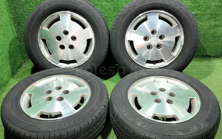 Диск оригинал с резиной Mitsubishi с шинами Bridgestoune 205/65 R15 за 120 000 тг. в Алматы