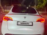 Tesla Model Y 2024 года за 19 000 000 тг. в Алматы – фото 2