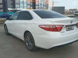 Toyota Camry 2015 года за 9 500 000 тг. в Актобе – фото 2