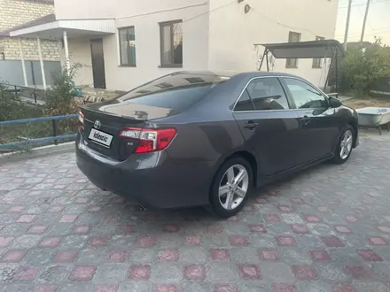 Toyota Camry 2014 года за 6 300 000 тг. в Атырау