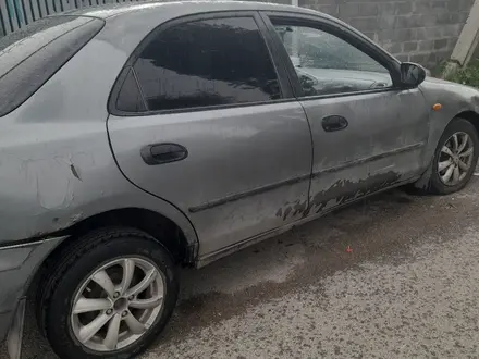 Mazda 323 1995 года за 600 000 тг. в Алматы – фото 2