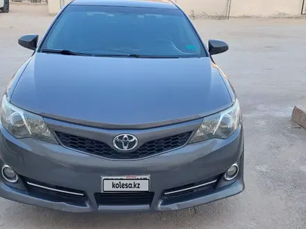 Toyota Camry 2014 года за 6 700 000 тг. в Жанаозен