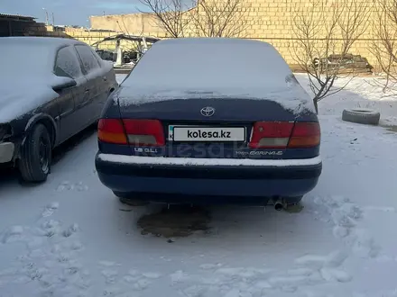 Toyota Carina E 1996 года за 1 976 537 тг. в Жанаозен