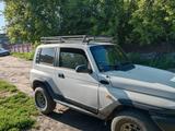 SsangYong Korando 1999 года за 2 550 000 тг. в Караганда – фото 2
