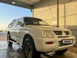 Mitsubishi L200 2005 годаfor2 850 000 тг. в Актау