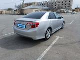 Toyota Camry 2012 года за 9 800 000 тг. в Жанаозен – фото 2