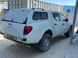 Mitsubishi L200 2010 года за 2 852 000 тг. в Атырау – фото 2
