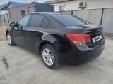 Chevrolet Cruze 2014 года за 2 900 000 тг. в Атырау – фото 2