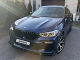 BMW X6 2021 года за 38 400 000 тг. в Караганда – фото 2