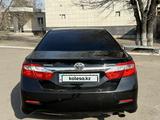 Toyota Camry 2014 года за 9 400 000 тг. в Экибастуз