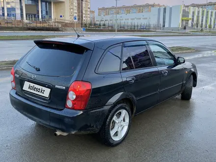 Mazda 323 2002 года за 2 600 000 тг. в Актобе – фото 9