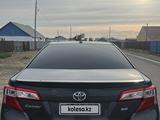 Toyota Camry 2014 года за 5 500 000 тг. в Атырау