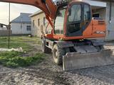 Doosan  DX140W 2013 года за 30 000 000 тг. в Шымкент