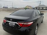 Toyota Camry 2015 года за 7 500 000 тг. в Атырау – фото 4
