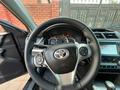 Toyota Camry 2014 года за 5 200 000 тг. в Актобе – фото 4