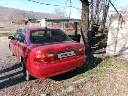 Mazda 323 1996 года за 900 000 тг. в Есик – фото 2