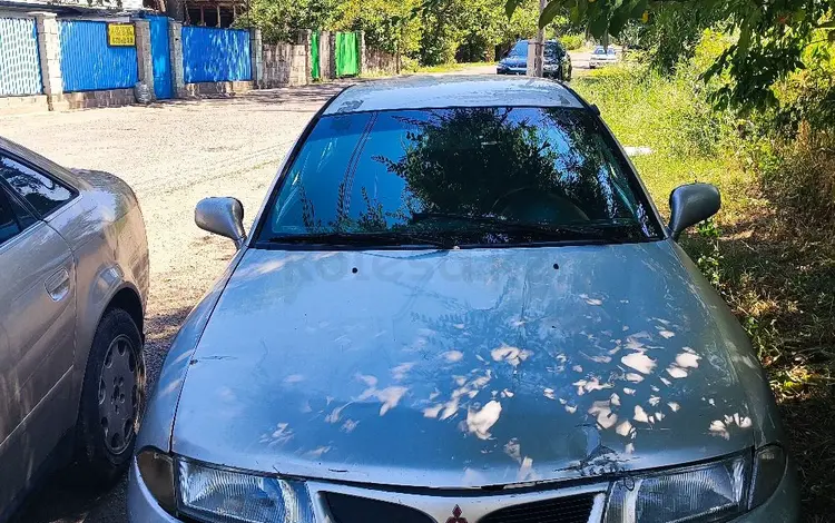 Mitsubishi Carisma 1998 годаүшін600 000 тг. в Жетиген