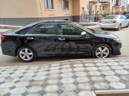 Toyota Camry 2013 года за 5 700 000 тг. в Атырау