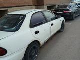 Mazda Familia 1995 года за 350 000 тг. в Астана – фото 3