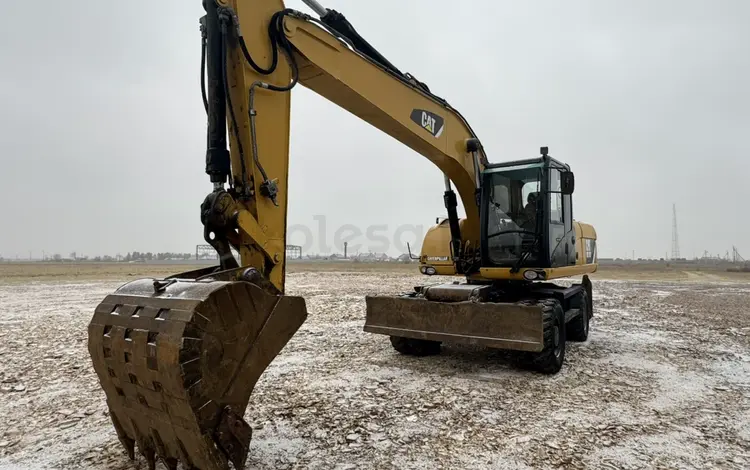 Сдам в аренду колесный экскаватор CAT с навесными (гидромолот, ямобур) в Кокшетау