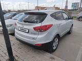 Hyundai Tucson 2012 годаүшін7 850 000 тг. в Астана – фото 4