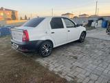 Renault Logan 2013 года за 1 700 000 тг. в Актобе – фото 2