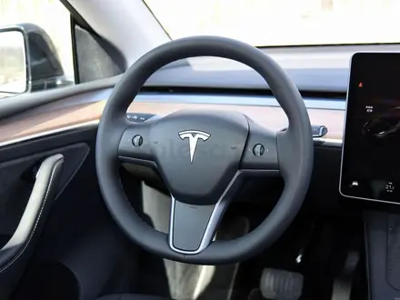Tesla Model Y 2023 года за 19 300 000 тг. в Алматы – фото 37