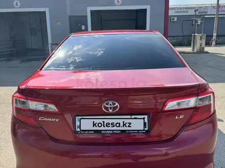 Toyota Camry 2013 года за 7 650 000 тг. в Актобе – фото 4