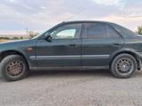 Mazda 626 1998 года за 1 800 000 тг. в Актобе – фото 4