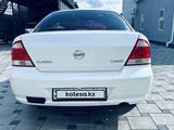 Nissan Almera 2012 года за 3 650 000 тг. в Атырау – фото 2