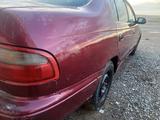 Toyota Carina E 1997 года за 900 000 тг. в Байконыр – фото 4