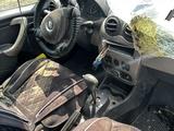 Renault Logan 2013 года за 888 888 тг. в Атырау – фото 4