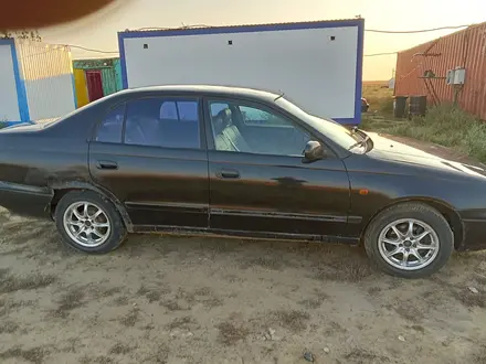 Toyota Carina E 1997 года за 1 200 000 тг. в Актобе – фото 6