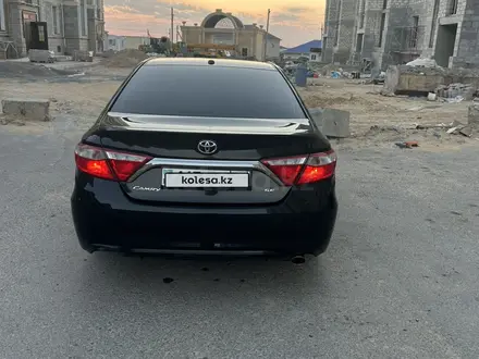 Toyota Camry 2014 года за 9 200 000 тг. в Жанаозен – фото 2