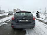 Ford Focus 2013 года за 3 950 000 тг. в Астана – фото 2