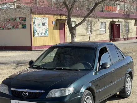 Mazda Protege 2001 года за 1 600 000 тг. в Байконыр