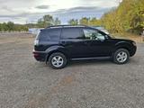 Mitsubishi Outlander 2012 года за 6 100 000 тг. в Караганда – фото 2