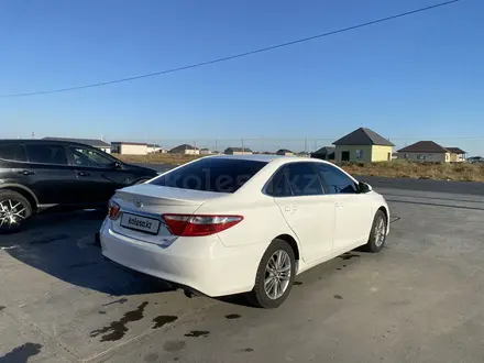 Toyota Camry 2015 года за 8 500 000 тг. в Атырау – фото 5