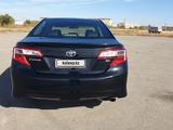 Toyota Camry 2013 годаfor8 600 000 тг. в Актобе – фото 5