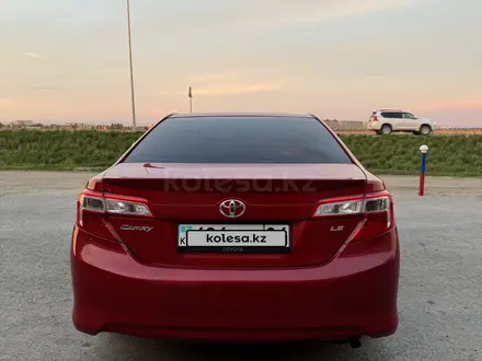 Toyota Camry 2013 года за 7 750 000 тг. в Актобе – фото 4