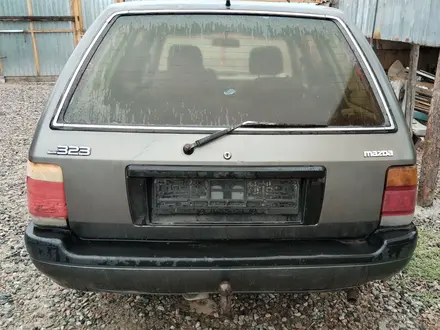 Mazda 323 1993 года за 550 000 тг. в Жетиген – фото 2