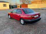 Mazda 323 1995 года за 980 000 тг. в Мерке – фото 2