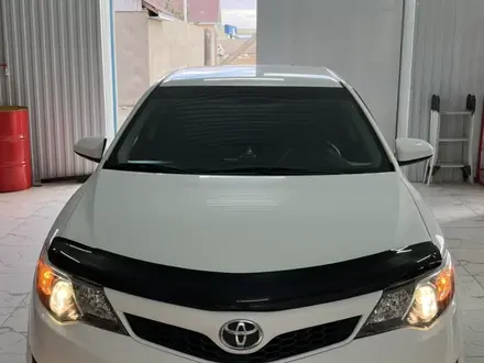 Toyota Camry 2014 года за 8 700 000 тг. в Жанаозен – фото 2