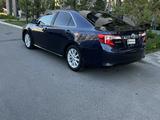 Toyota Camry 2014 года за 6 300 000 тг. в Атырау