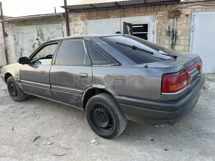 Mazda 626 1991 года за 450 000 тг. в Жанаозен – фото 4