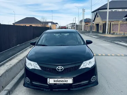 Toyota Camry 2013 года за 7 100 000 тг. в Актобе