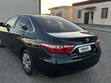 Toyota Camry 2015 года за 7 500 000 тг. в Жанаозен – фото 4