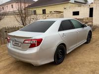 Toyota Camry 2013 годаfor5 650 000 тг. в Жанаозен