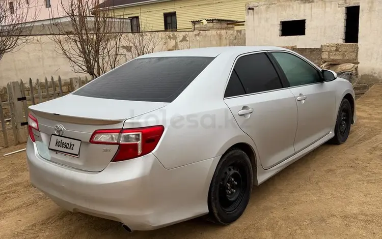 Toyota Camry 2013 годаfor5 650 000 тг. в Жанаозен