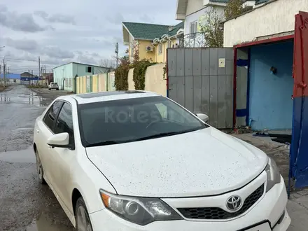 Toyota Camry 2012 года за 8 100 000 тг. в Атырау